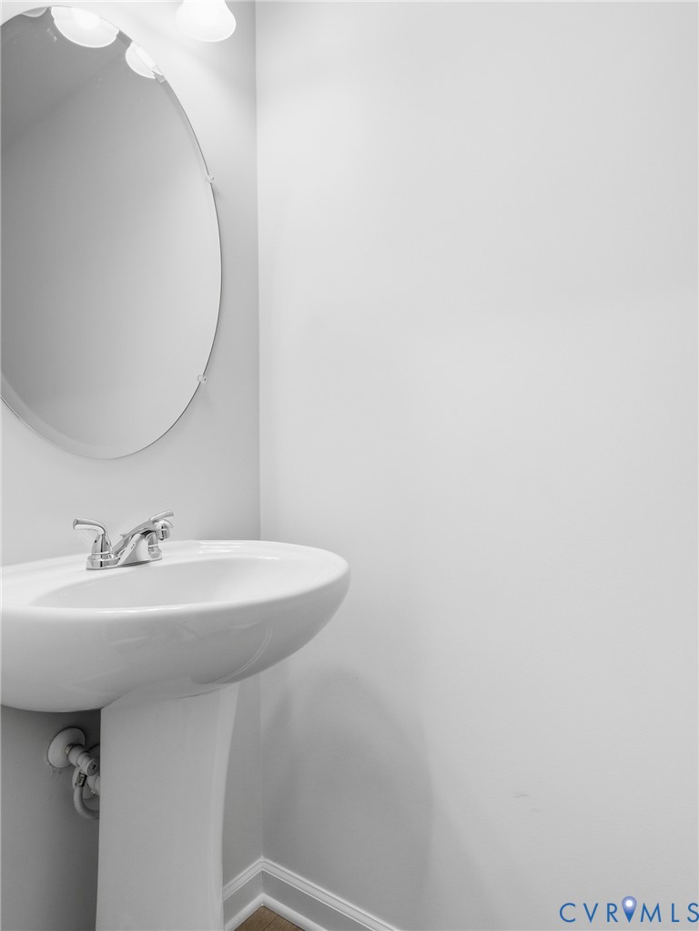 548 Wendenburg Terrace Aylett, VA 23009 - Photo 20 of 21 a bathroom with a sink and mirror