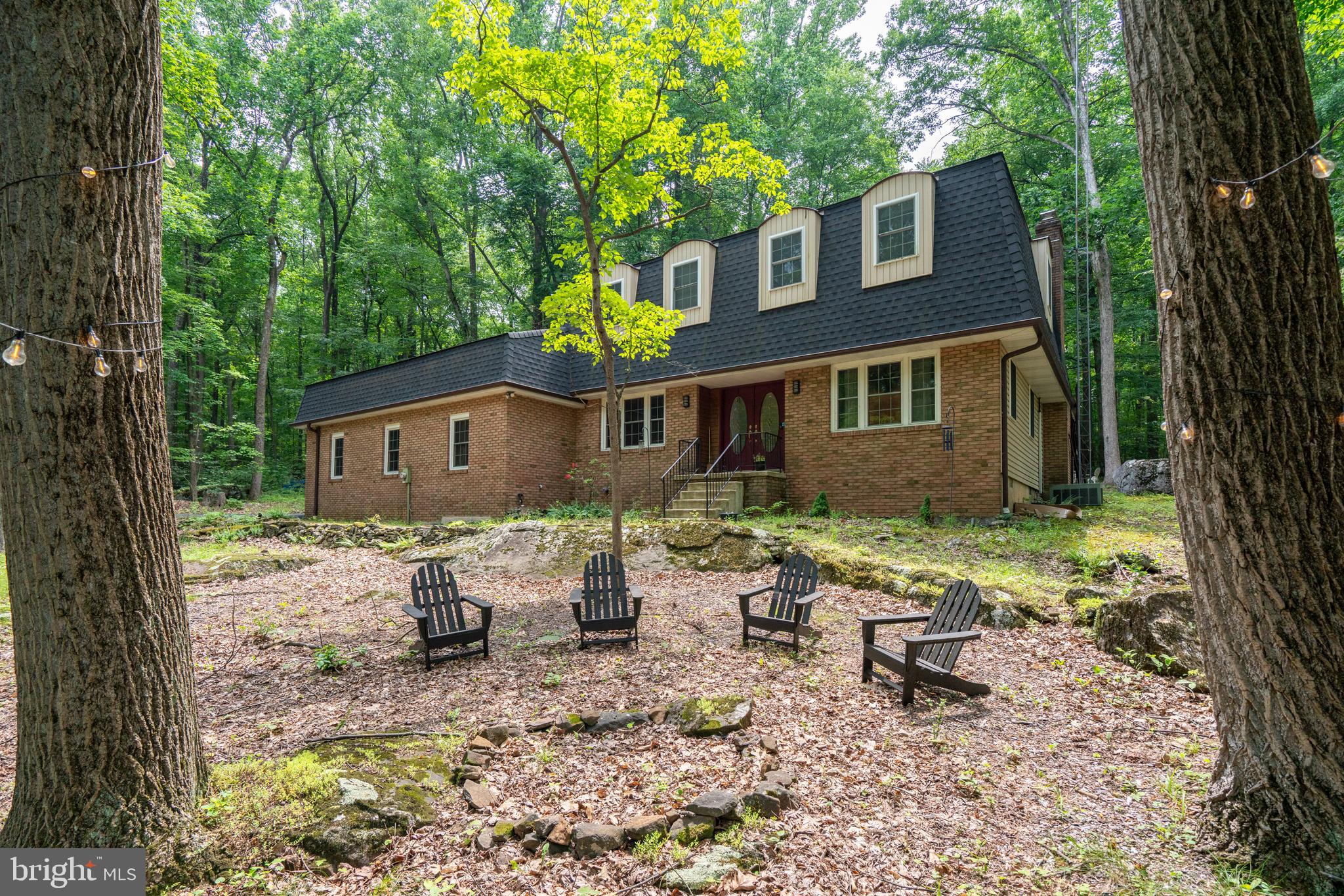 284 Whites Mill Road Green Lane, PA 18054 - Photo 1 of 54 a front view of a house with yard and seating area