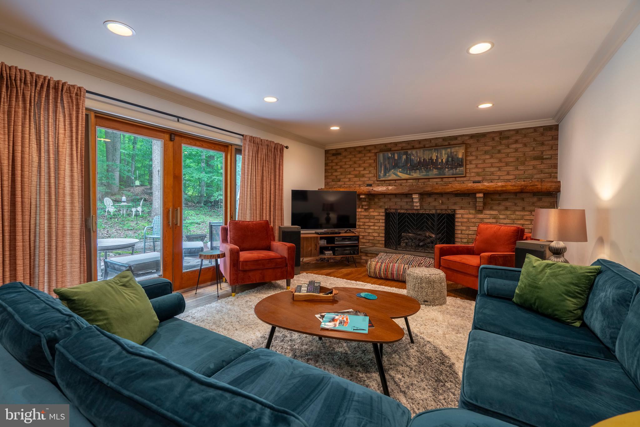 284 Whites Mill Road Green Lane, PA 18054 - Photo 24 of 54 a living room with furniture fireplace and a large window