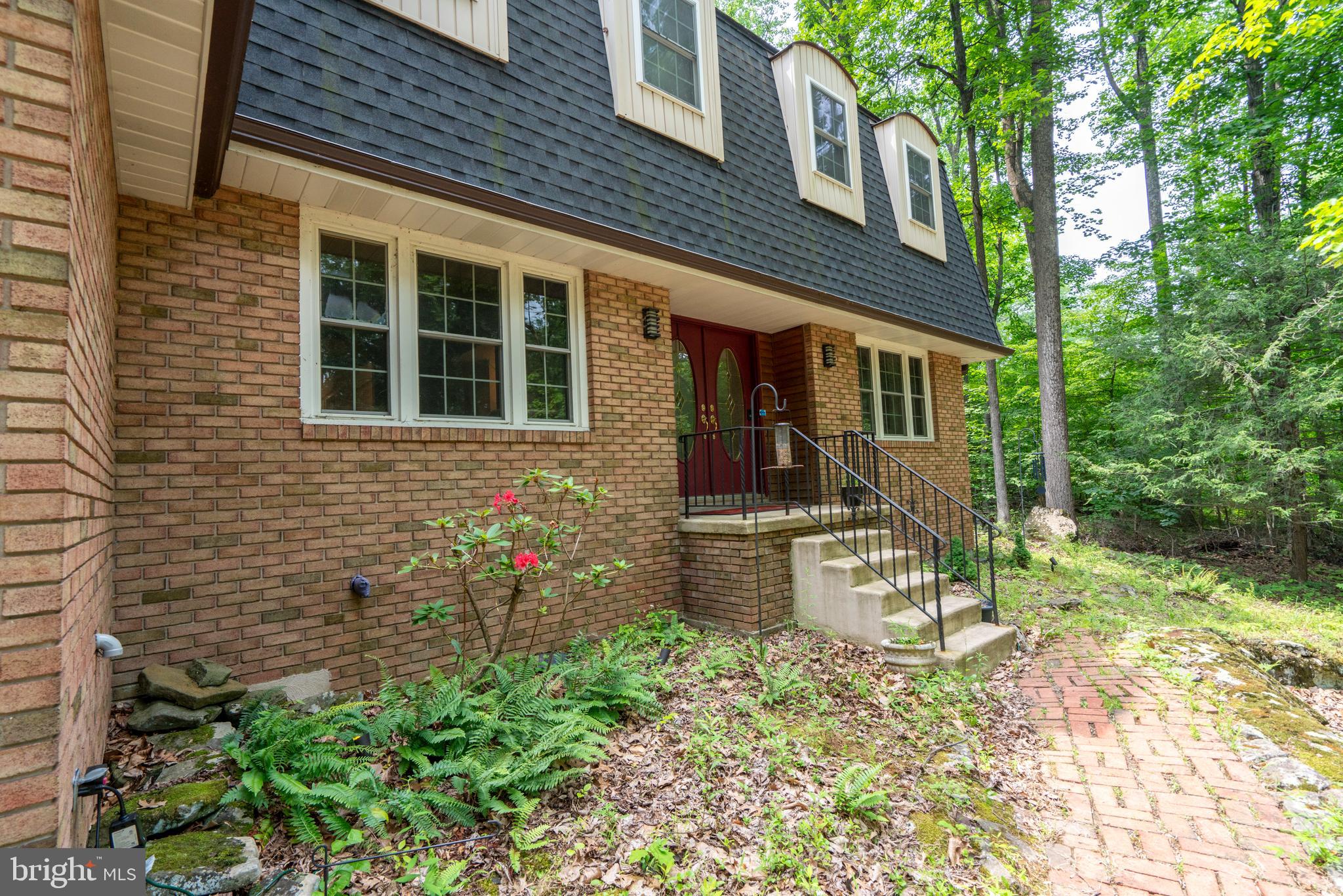 284 Whites Mill Road Green Lane, PA 18054 - Photo 6 of 54 a front view of a house with a yard