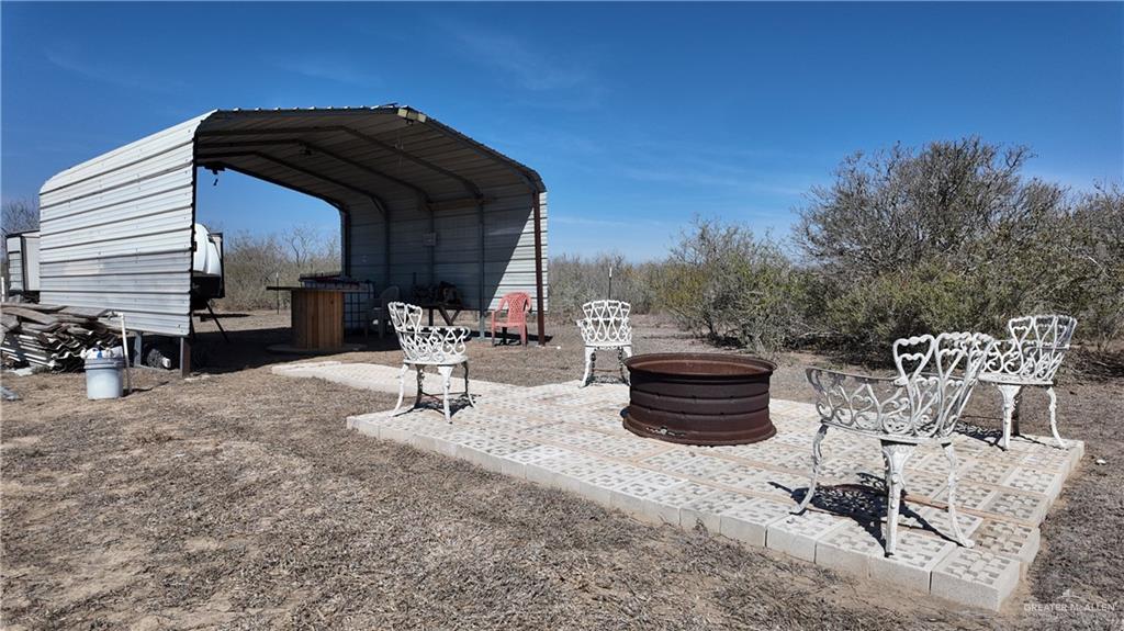 0 Cr 309 Road Encino, TX 78353 - Photo 5 of 18 a view of a chairs and table in the patio