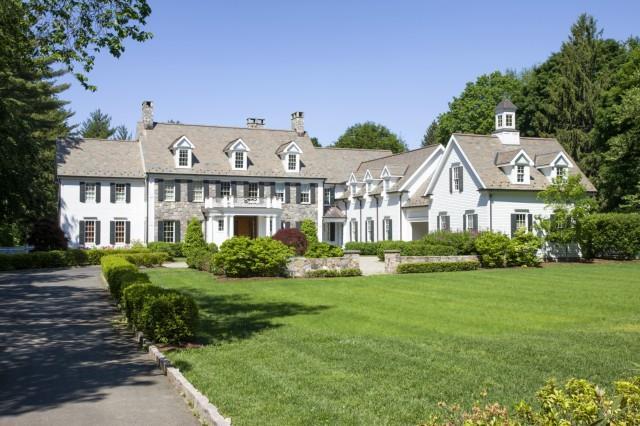 38 Parsonage Road Greenwich, CT 06830 - Photo 1 of 1 a front view of a house with a yard