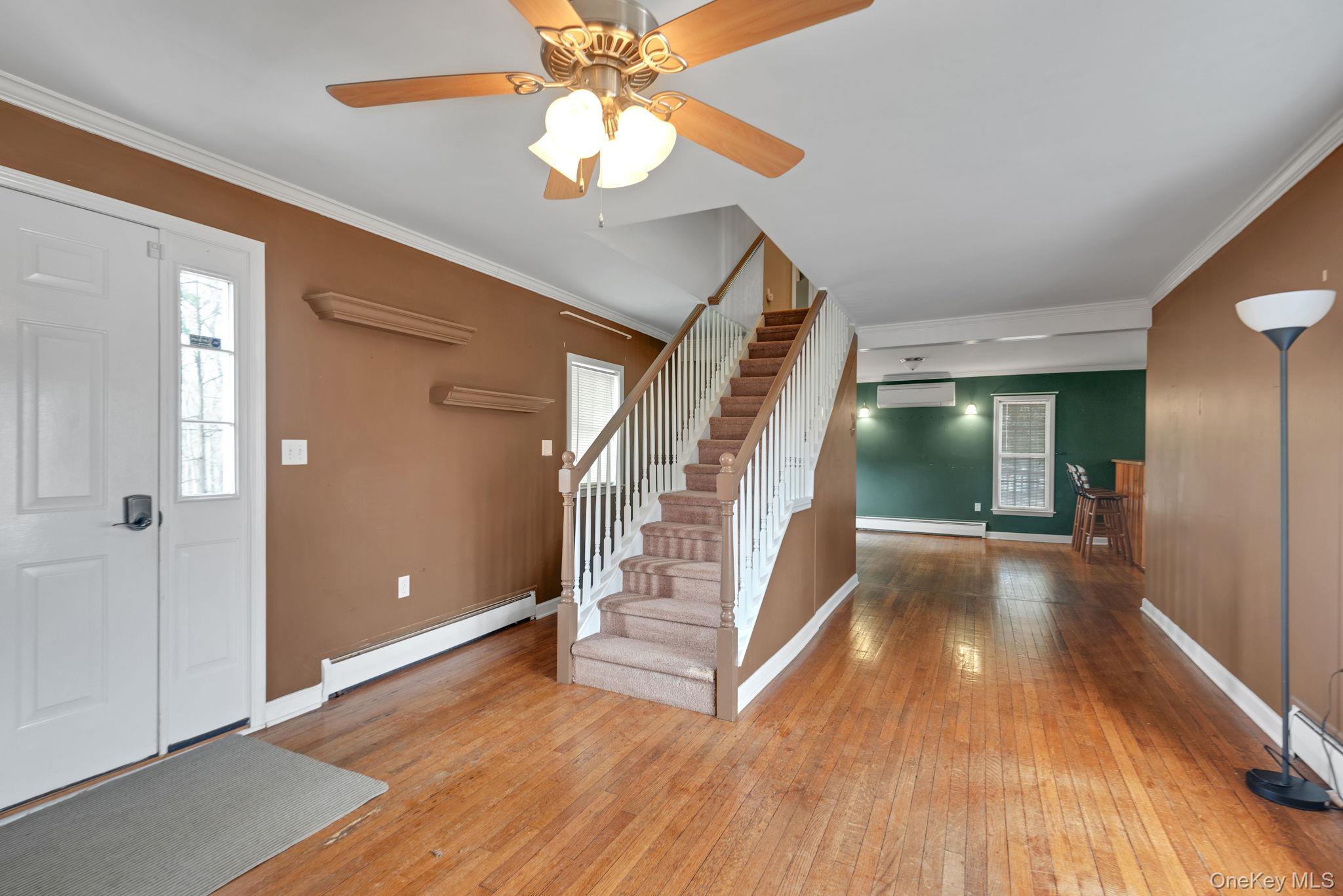 37 Pressler Road Wallkill, NY 12589 - Photo 4 of 25 wooden floor in an empty room with a window
