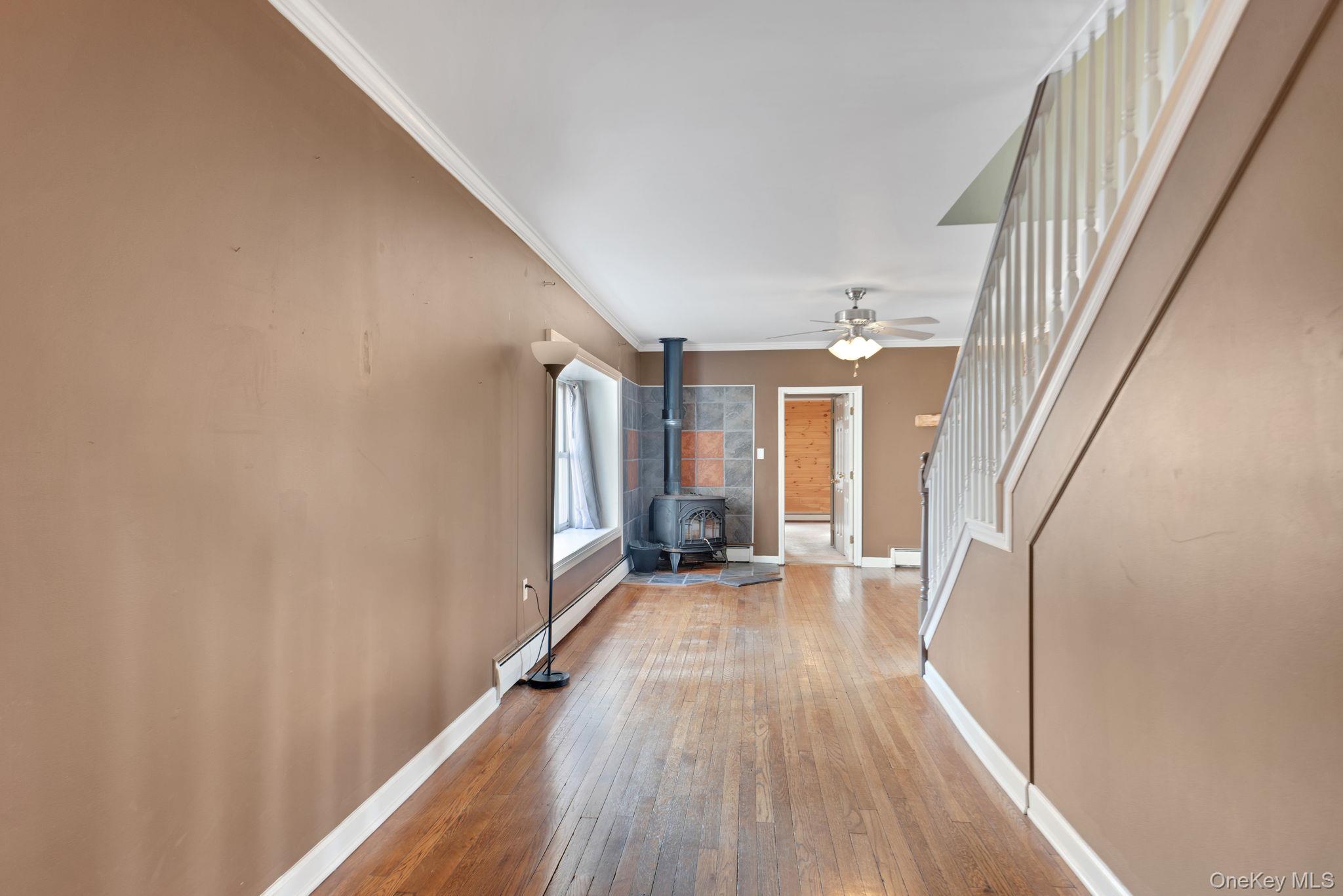37 Pressler Road Wallkill, NY 12589 - Photo 6 of 25 a view of a hallway with wooden floor and staircase