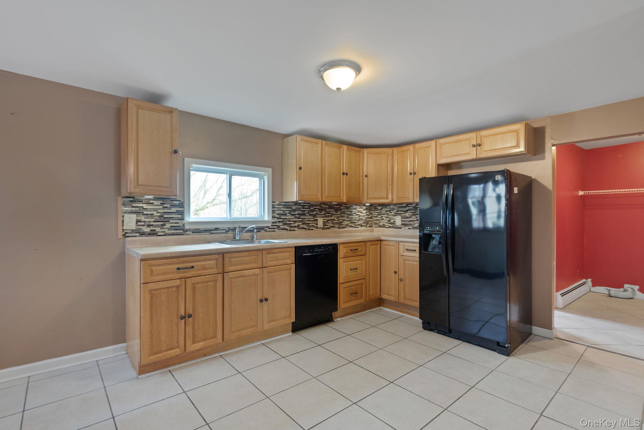 37 Pressler Road Wallkill, NY 12589 - Photo 9 of 25 a kitchen with stainless steel appliances granite countertop a refrigerator and a stove top oven