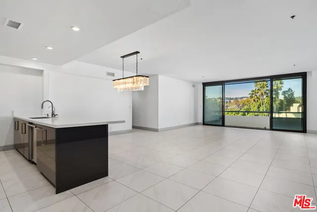 a view of kitchen with furniture and cabinets