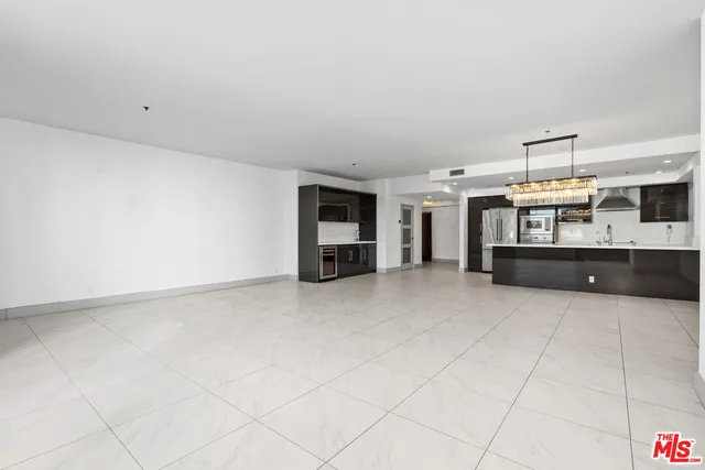 a kitchen with stainless steel appliances a refrigerator and a sink