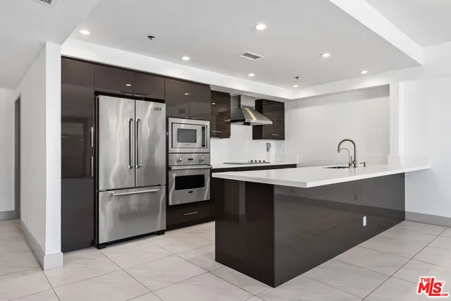 a kitchen with a cabinets and appliances