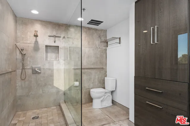 a bathroom with a sink vanity and mirror