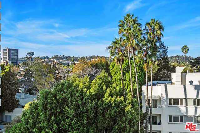 a room with gym equipment and a large window