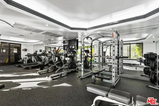 a view of a dining room with furniture large windows and wooden floor