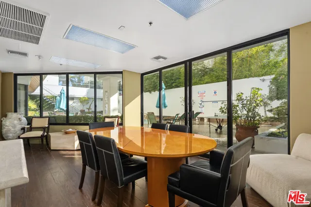 a view of a swimming pool with outdoor seating