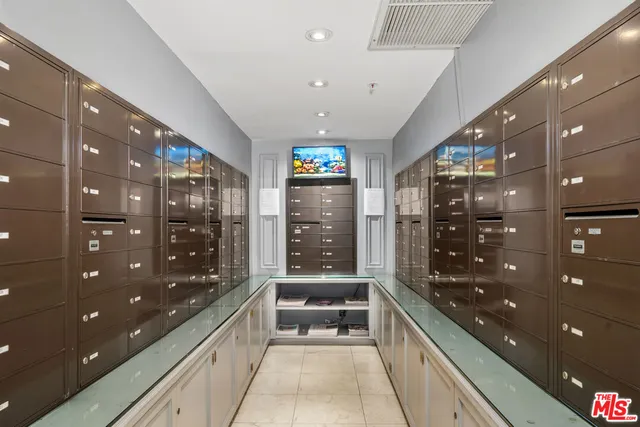 a large kitchen with granite countertop a large glass top table and chairs