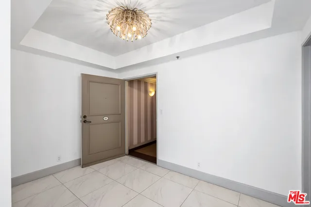 a bathroom with a sink a large mirror and a shower