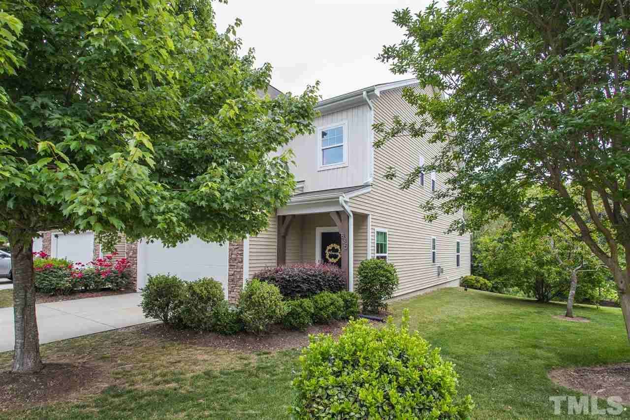 835 Davidson Point Road Cary, NC 27513 - Photo 2 of 30 a front view of a house with a garden