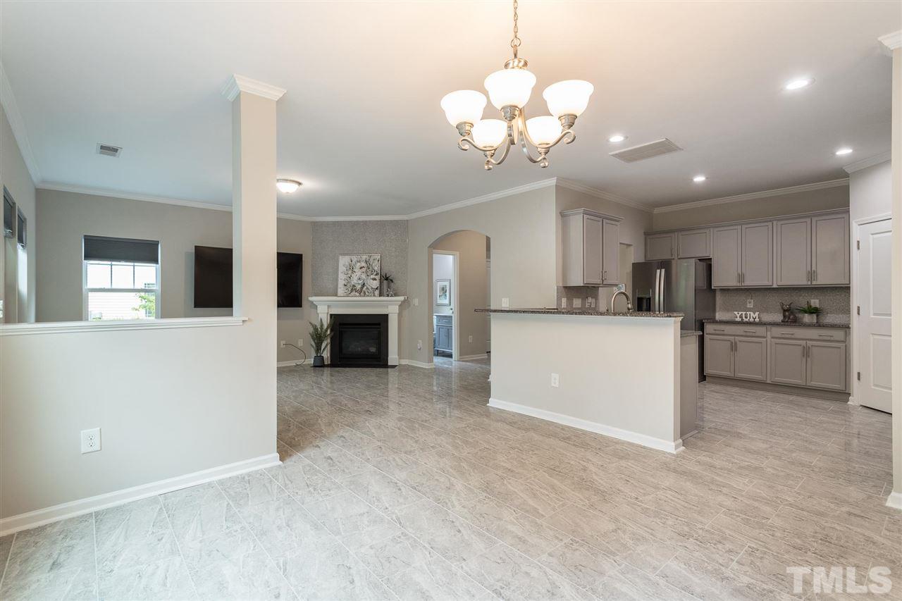 835 Davidson Point Road Cary, NC 27513 - Photo 13 of 30 a view of a kitchen with a sink and chandelier