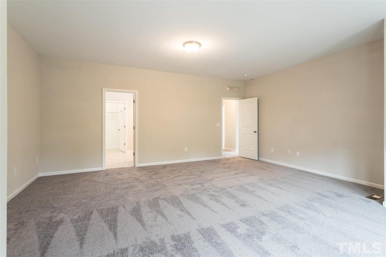 835 Davidson Point Road Cary, NC 27513 - Photo 18 of 30 a view of an empty room and window