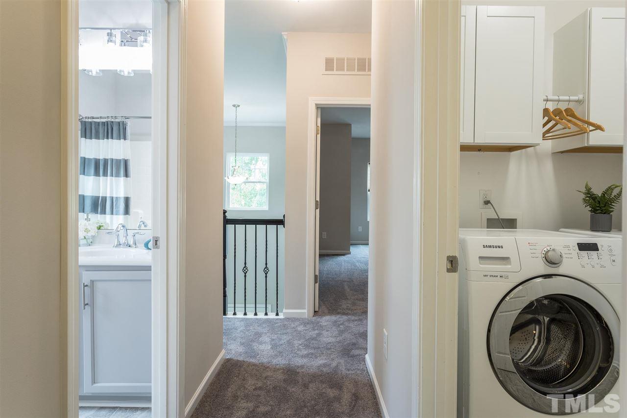 835 Davidson Point Road Cary, NC 27513 - Photo 25 of 30 a view of a hallway with washer and dryer
