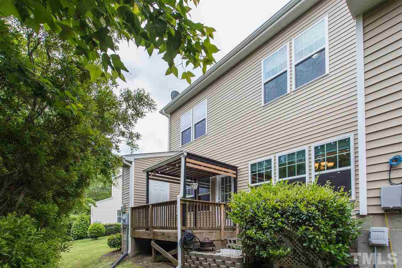 835 Davidson Point Road Cary, NC 27513 - Photo 30 of 30 a front view of a house with a yard and potted plants