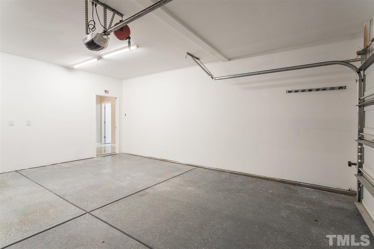 835 Davidson Point Road Cary, NC 27513 - Photo 6 of 30 a view of a room with racks on the wall