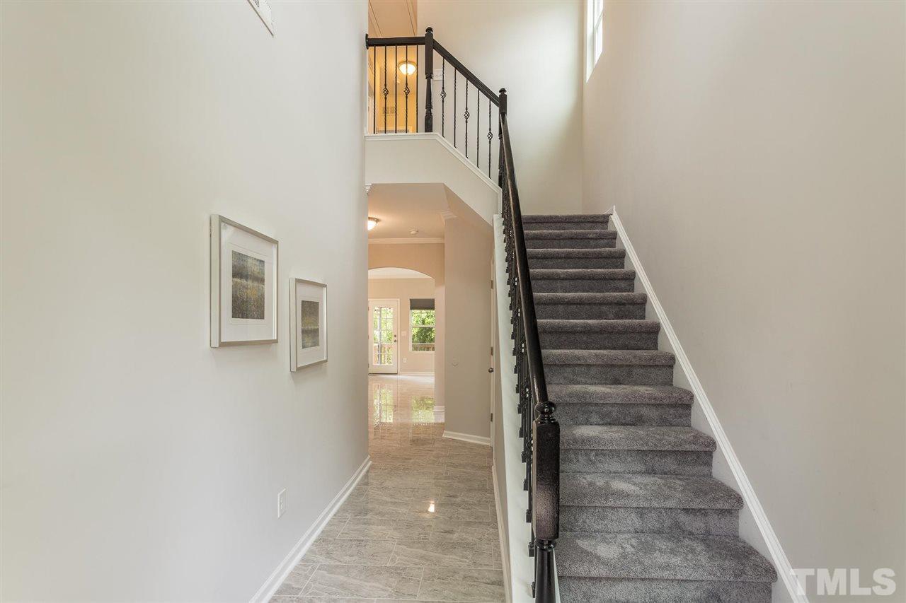 835 Davidson Point Road Cary, NC 27513 - Photo 9 of 30 a view of a hallway with staircase