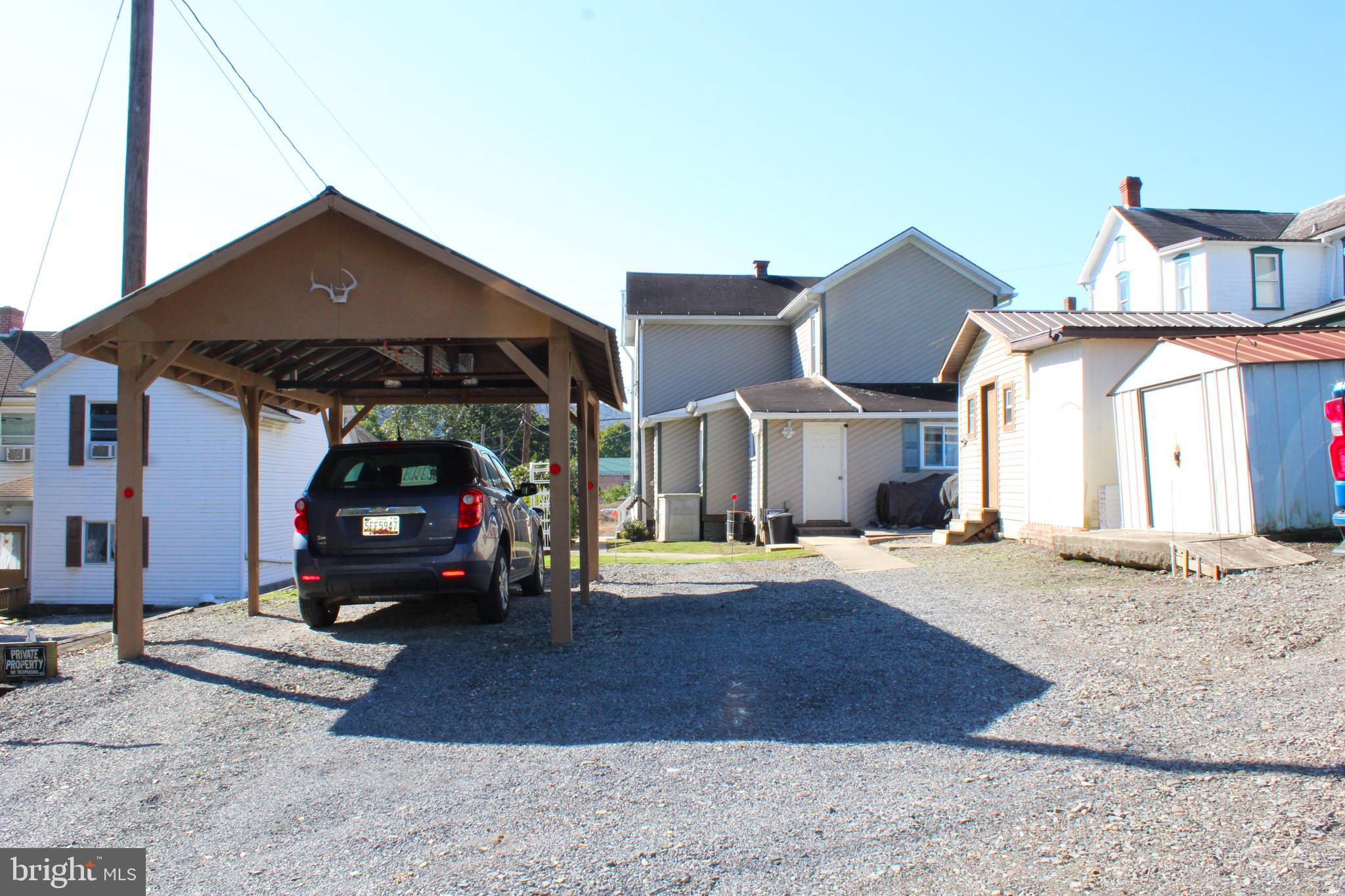 10117 Hummingbird Street Ellerslie, MD 21529 - Photo 11 of 76 a front view of a house with a yard