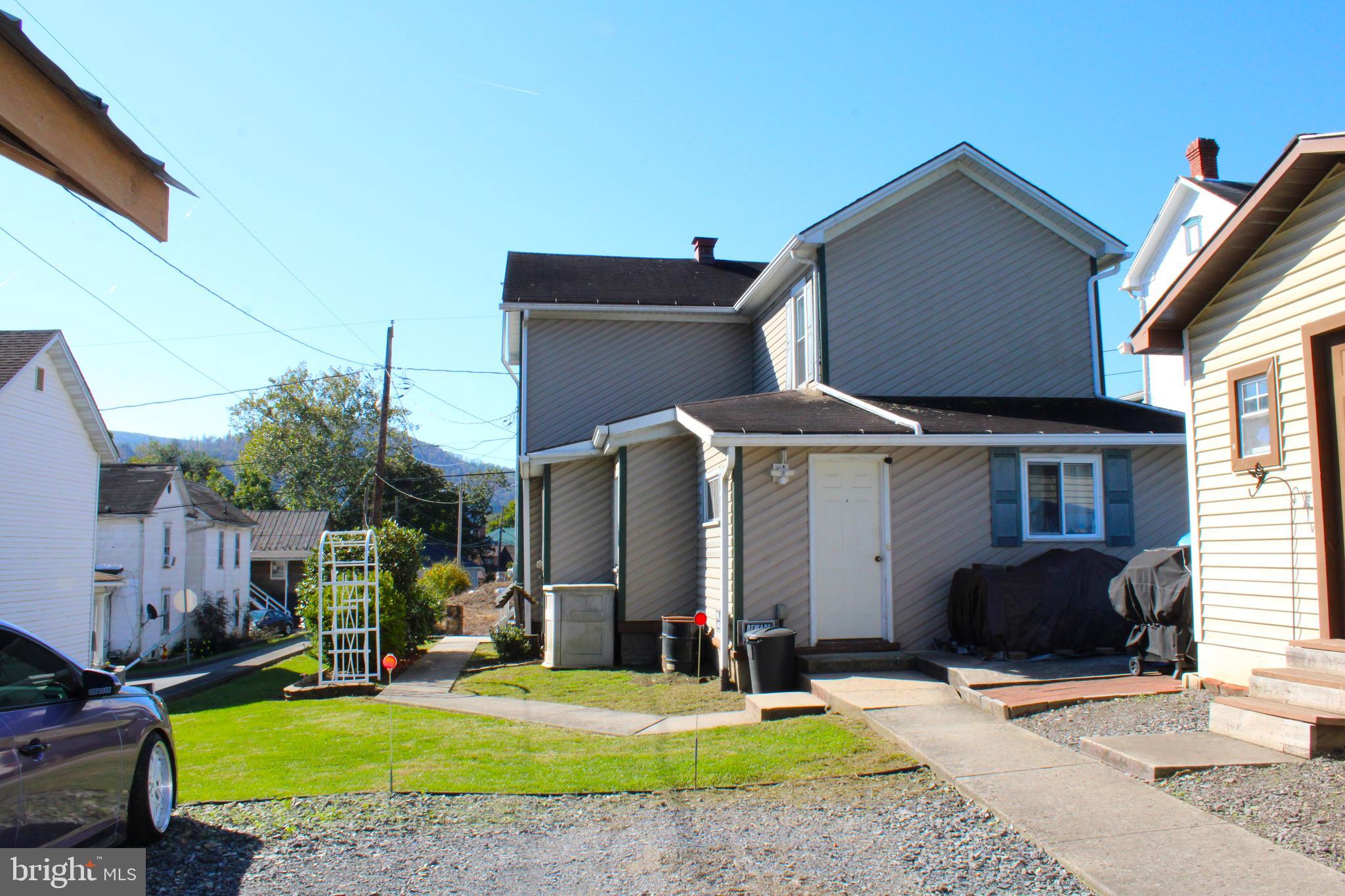 10117 Hummingbird Street Ellerslie, MD 21529 - Photo 15 of 76 a front view of a house with a yard
