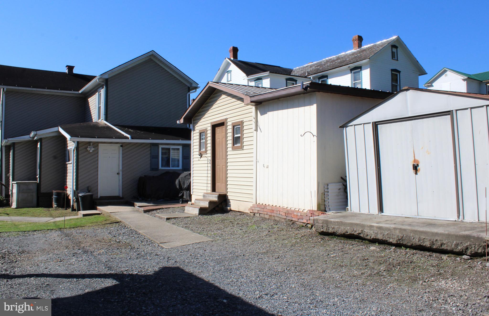 10117 Hummingbird Street Ellerslie, MD 21529 - Photo 17 of 76 a front view of a house with garden