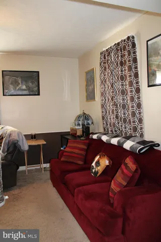 a kitchen with a refrigerator and a stove top oven