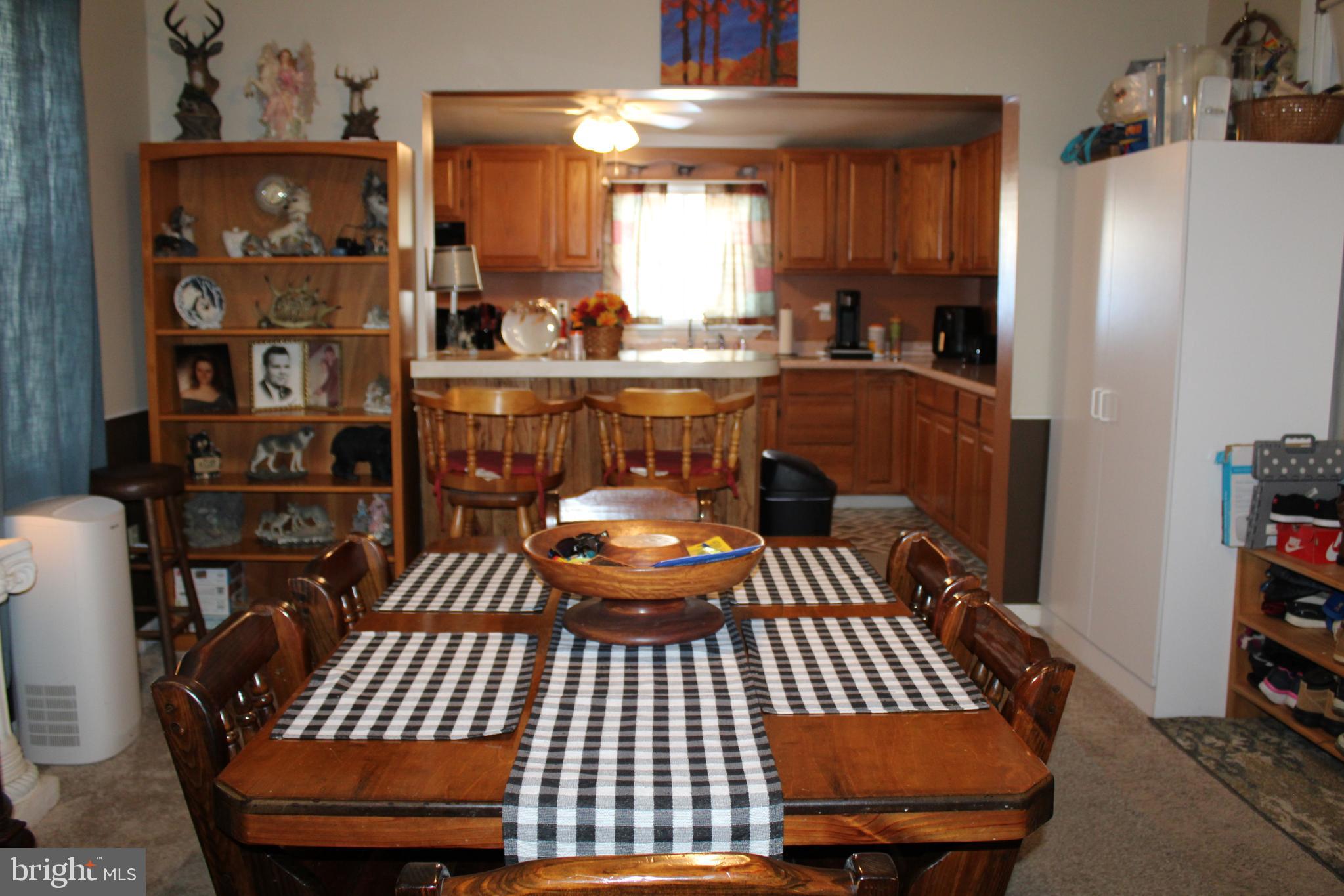 10117 Hummingbird Street Ellerslie, MD 21529 - Photo 37 of 76 a view of a room with furniture and a chandelier