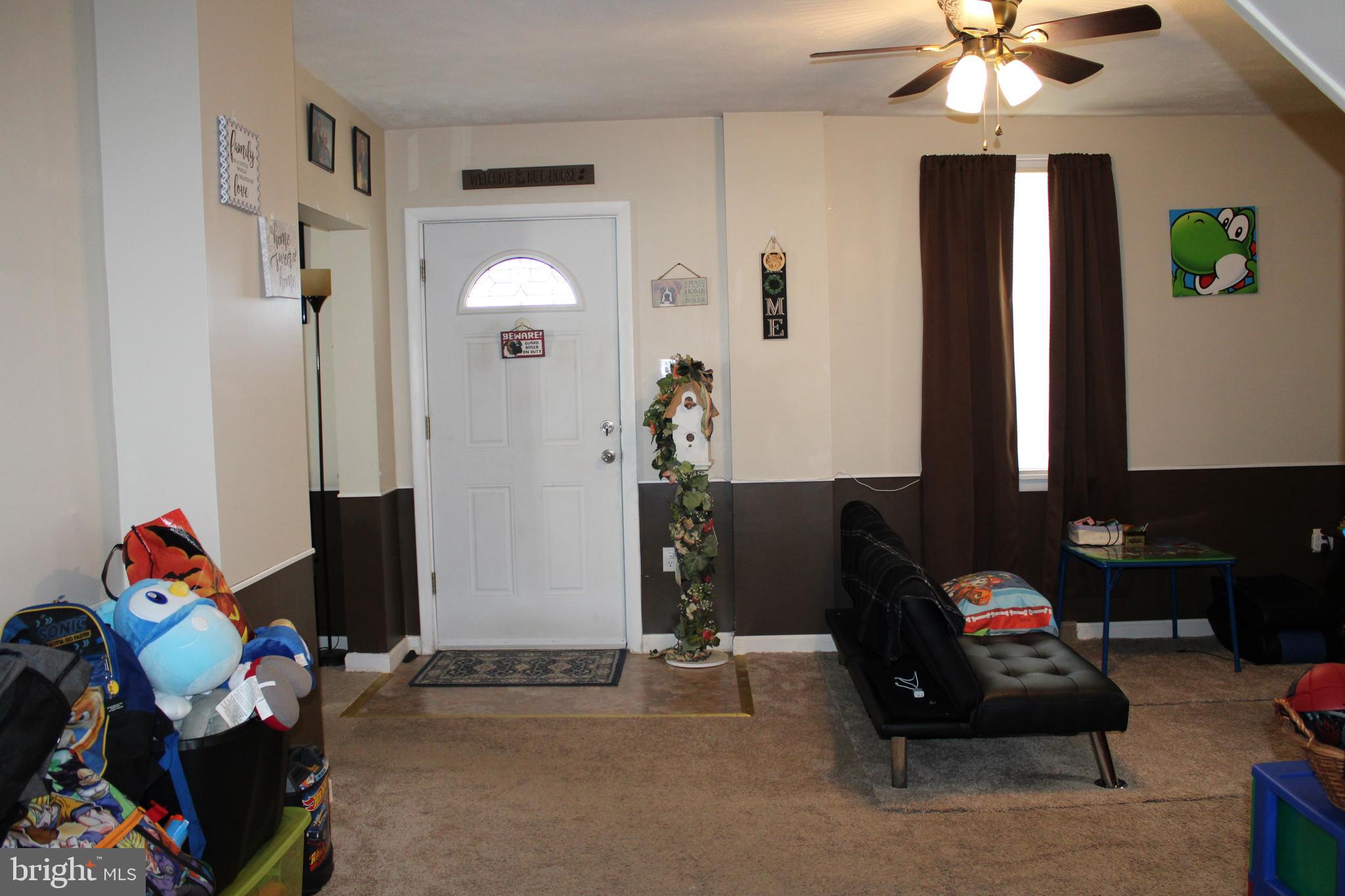 10117 Hummingbird Street Ellerslie, MD 21529 - Photo 52 of 76 a bedroom with furniture and a fan