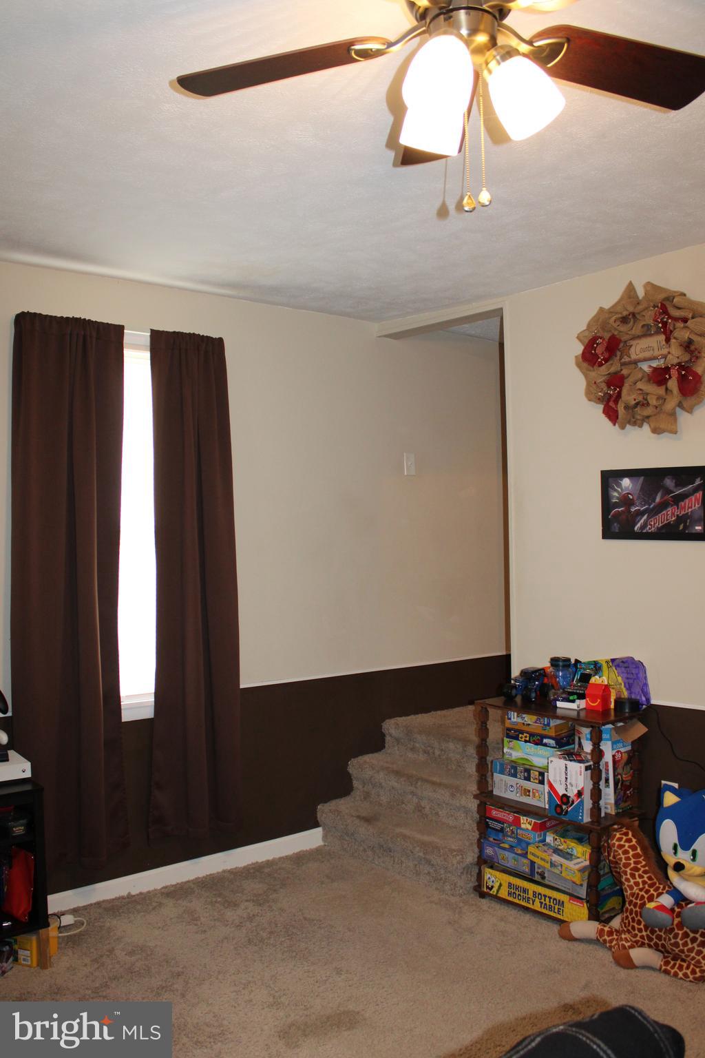 10117 Hummingbird Street Ellerslie, MD 21529 - Photo 55 of 76 a bedroom with bed and a window