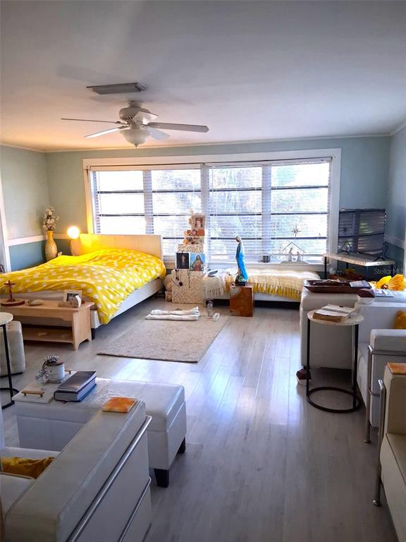 2455 Royal Road DeLand, FL 32724 - Photo 11 of 18 a bedroom with furniture and a wooden floor