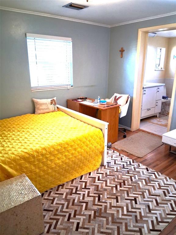 2455 Royal Road DeLand, FL 32724 - Photo 13 of 18 a bedroom with a bed and a walk in closet