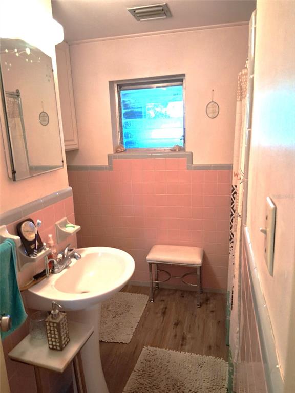 2455 Royal Road DeLand, FL 32724 - Photo 14 of 18 a bathroom with a sink a toilet and a mirror