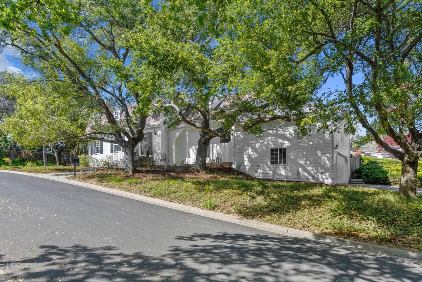 319 Montclair Road Los Gatos, CA 95032 - Photo 1 of 1 a view of a house with a yard and large trees