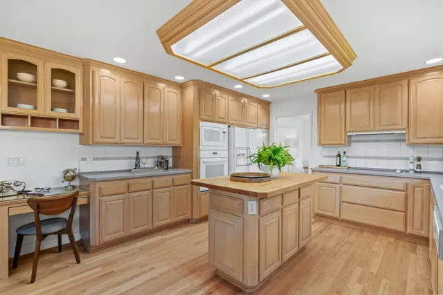 a kitchen with a sink cabinets and window