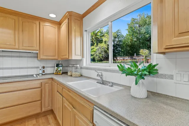 a kitchen with sink and window