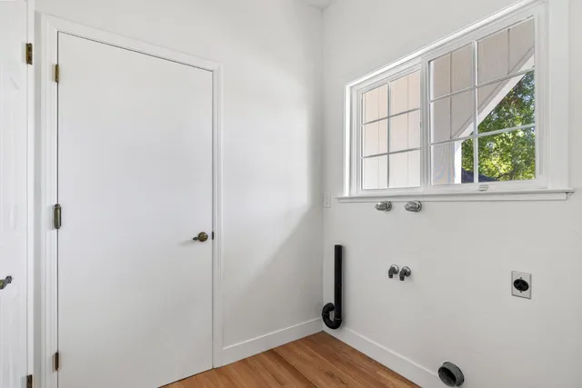 a view of front door with wooden floor