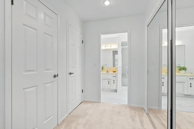 a view of a bathroom from a hallway