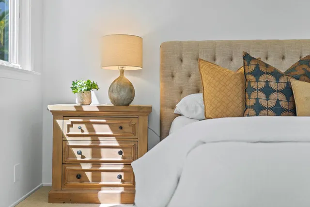 a bedroom with a bed and dresser