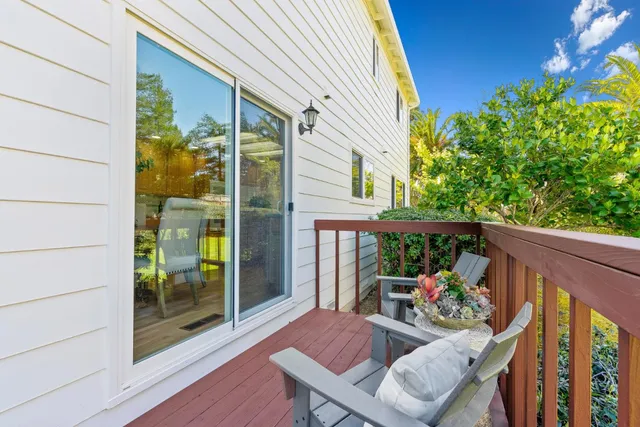 a view of a balcony with furniture