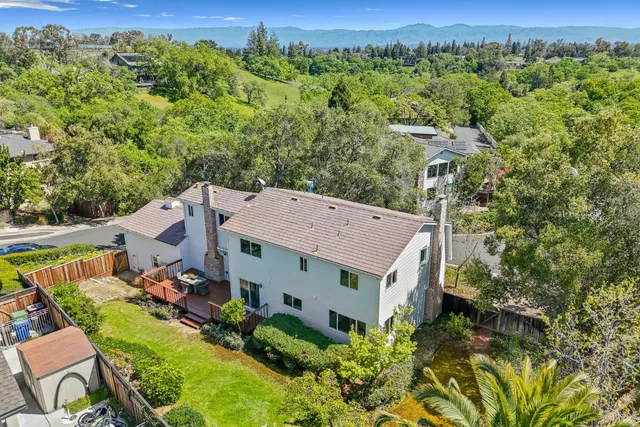an aerial view of a house with a garden