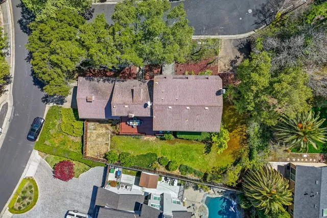 an aerial view of a house with a garden