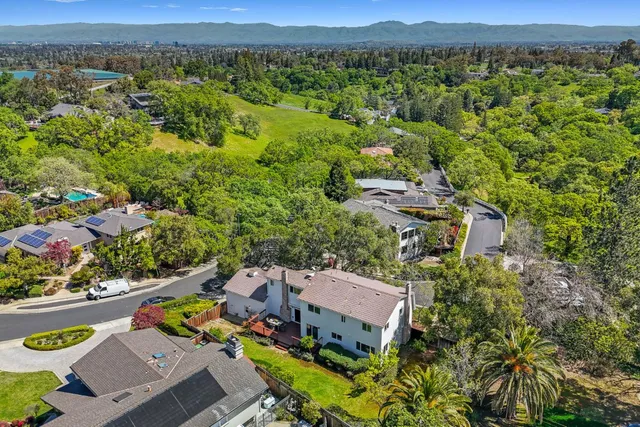 an aerial view of a house with a garden