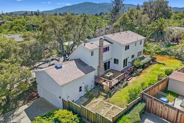 an aerial view of a house with a garden