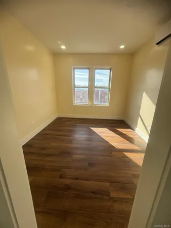 a view of an empty room and window