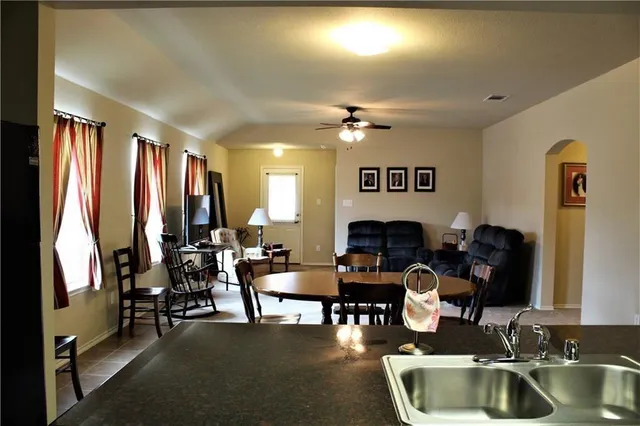 a view of a workspace with furniture and a potted plant