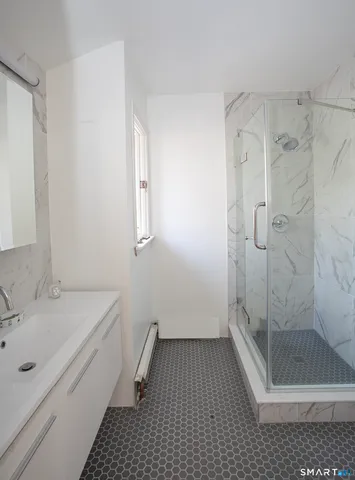 a bathroom with a sink and shower