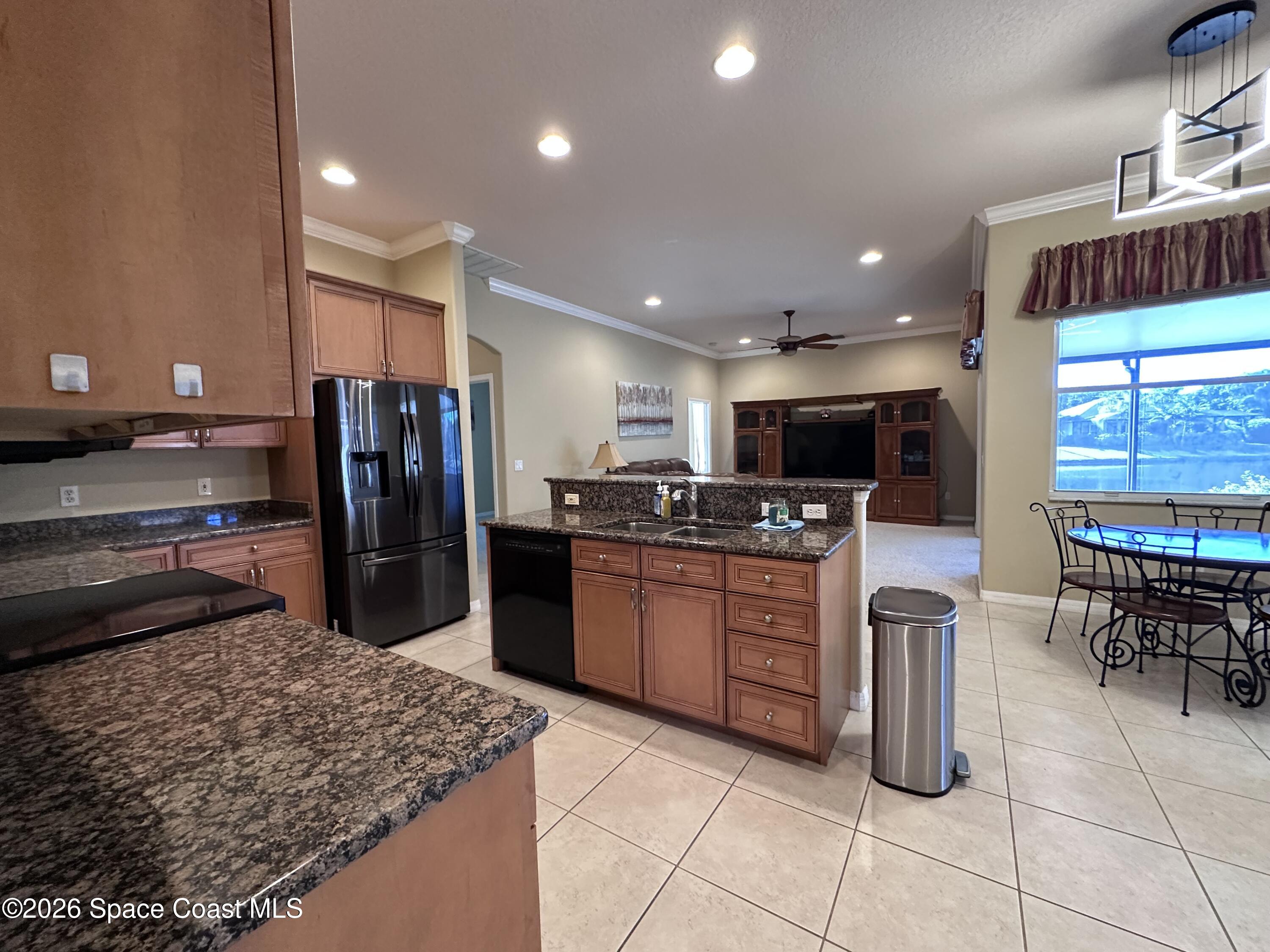 883 Spring Oak Drive Melbourne, FL 32901 - Photo 18 of 45 a kitchen with stainless steel appliances microwave stove refrigerator and cabinets